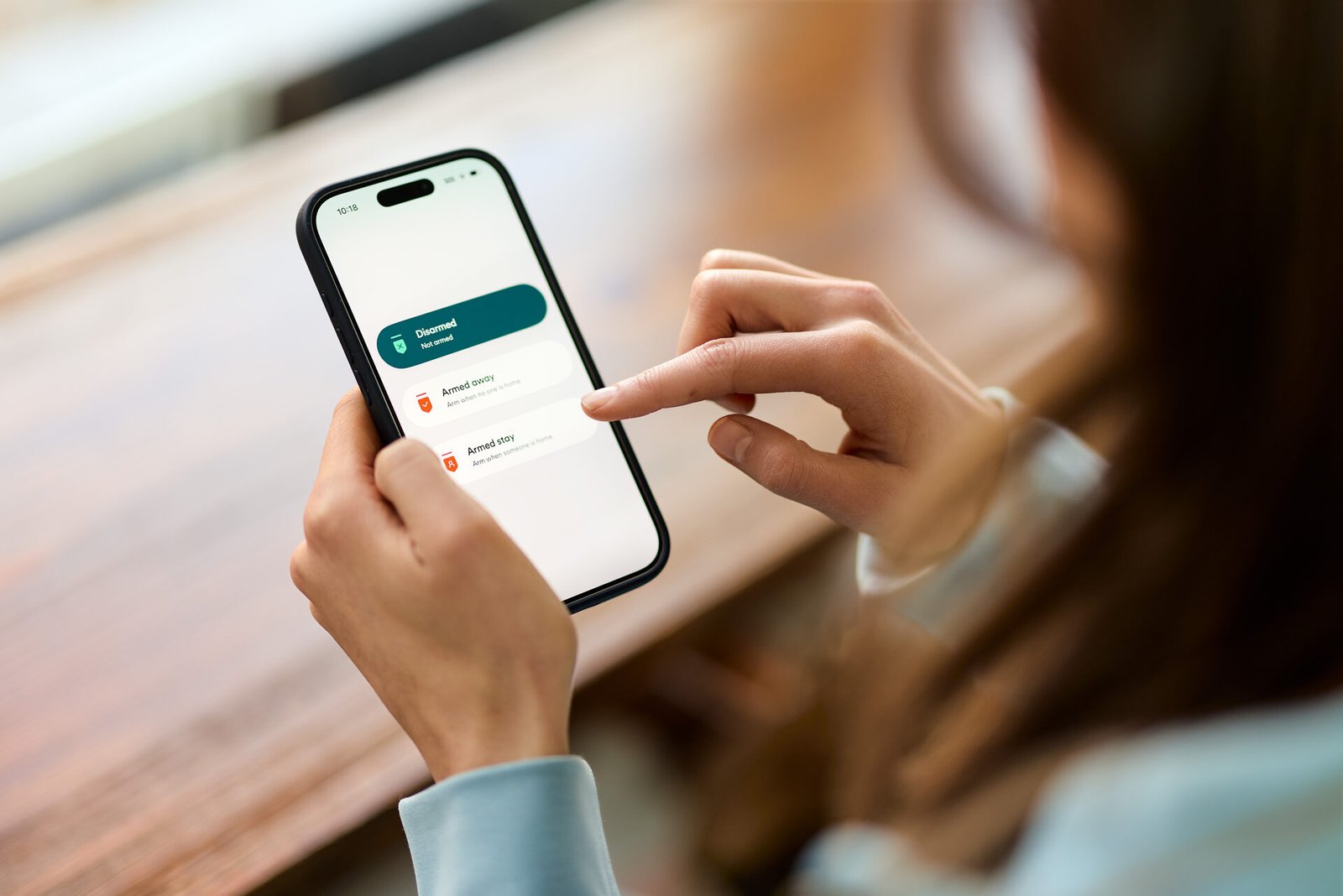Woman using Vivint app on phone